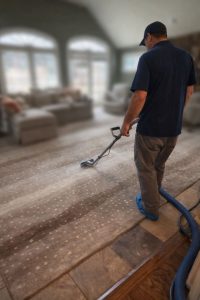 Billy cleaning a rug for a customer