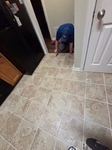 Billy applying grout color sealer