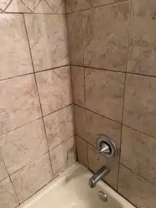 Dirty shower tub before professional cleaning in Memphis TN