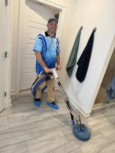 Billy cleaning tile and grout