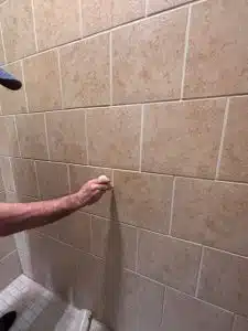 Grout color sealing application in shower in Collierville TN
