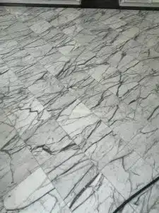 marble bathroom floor before cleaning and polishing